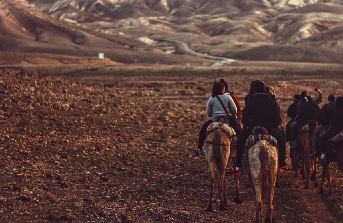 Cowpolk riding horses along the Santa Fe Trail